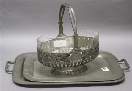Two hammered pewter trays and a secessionist basket largest tray 46cm